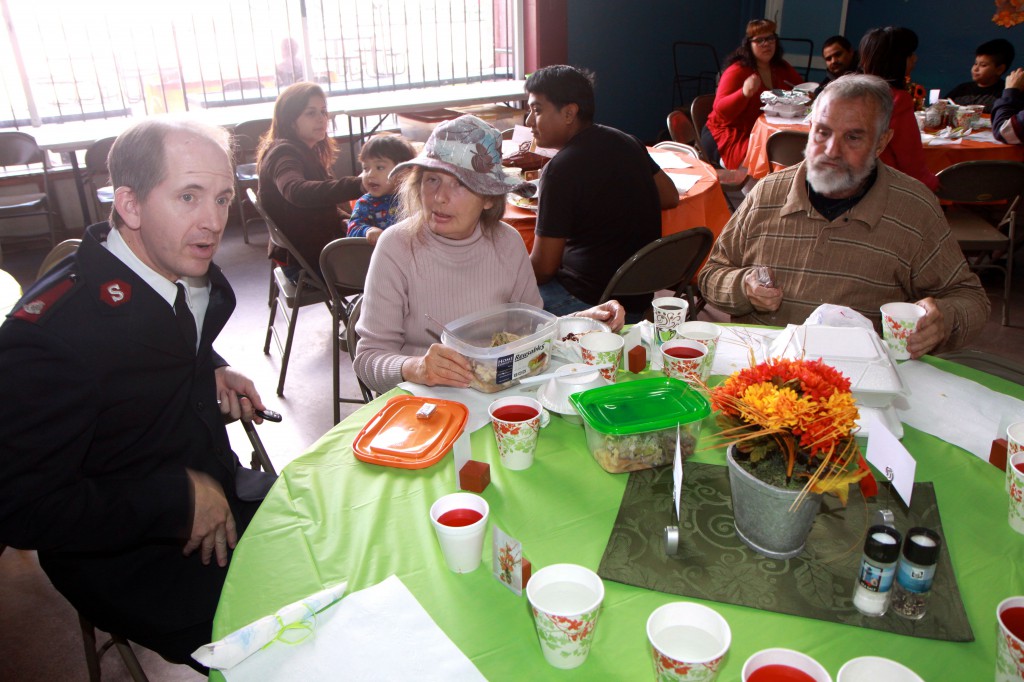 Salvation Army Major Daniel henderson shares Christmas dinner with a family at he Corps office.  A $20,000 Donation from the San Manuel Tribe of Mission Indians helped serve 60,475 Meals to those in need in last year.