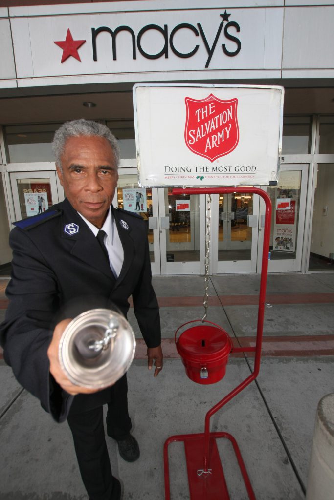 Photo 4 IMG_1538 Haskel at Macys: Mr. Haskel Herndon is ringing his Christmas bell at the Macy’s department store at the Inland Center Mall. Haskel greets every customer he comes in contact with. Haskel opens the door for the ladies and for those with handfuls of packages! Haskel has been a Soldier with the Salvation Army for 3 months now. Photo By Ricardo Tomboc 